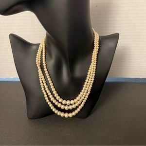 Good pre owned condition three strand faux peals necklace